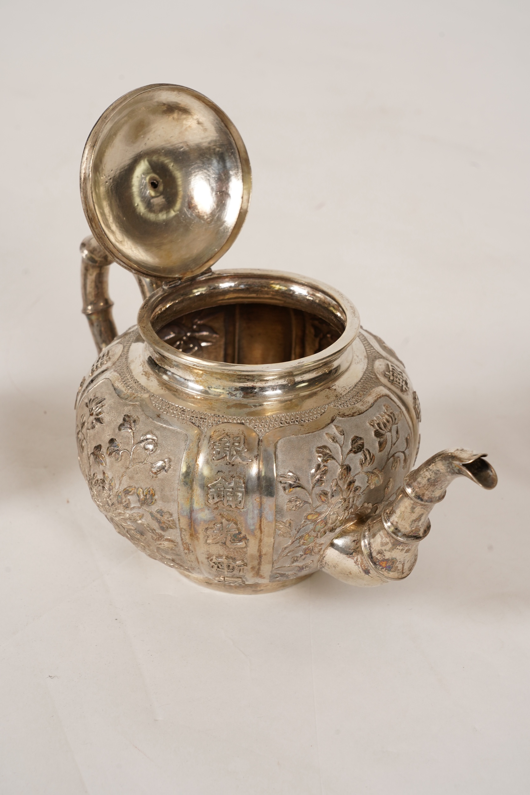 A late 19th/early 20th century Chinese Export white metal three-piece tea set, maker's mark WA